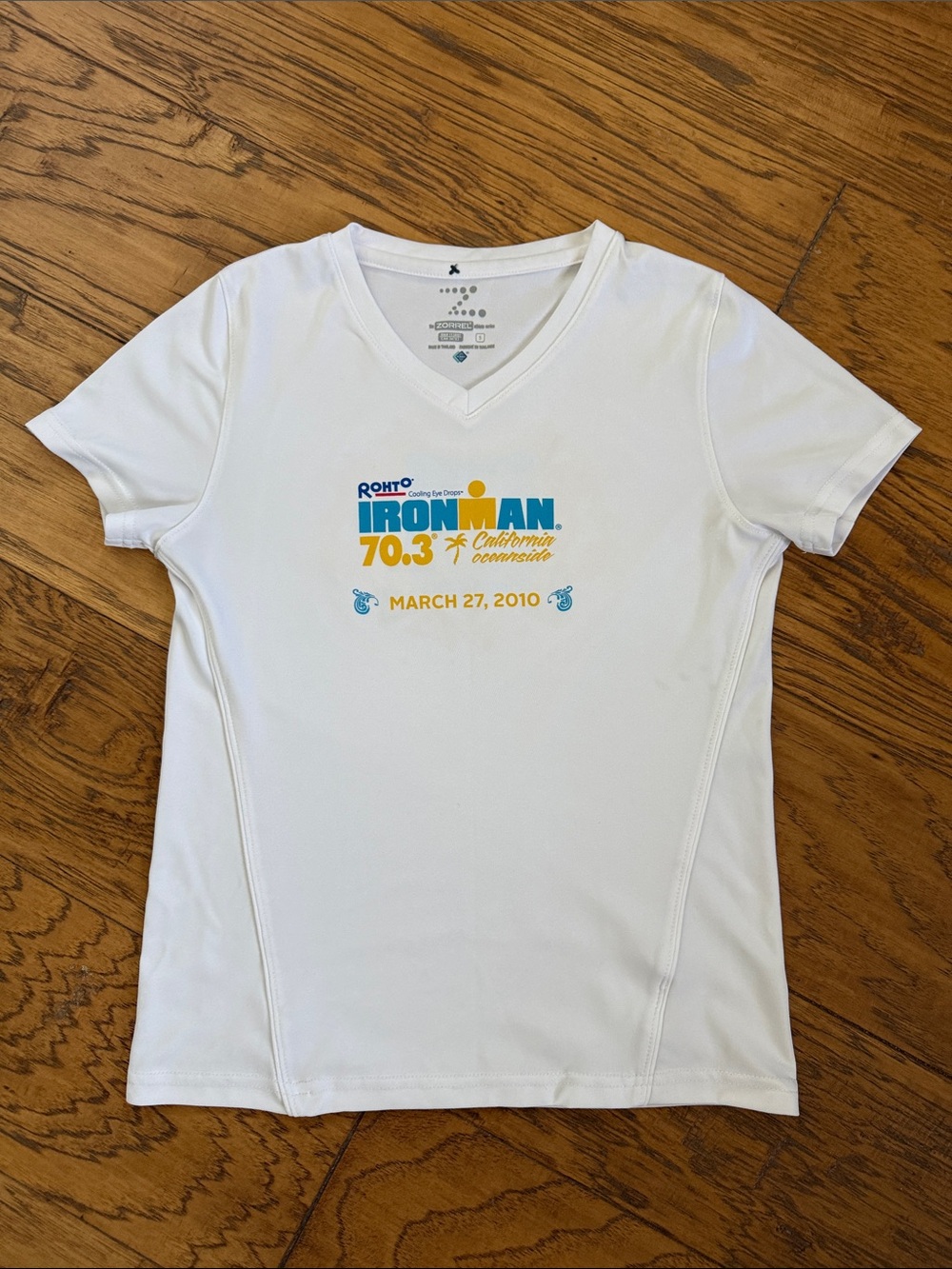 Iron Man White V-Neck Short Sleeve Women's Tee with Blue and Yellow Logo
